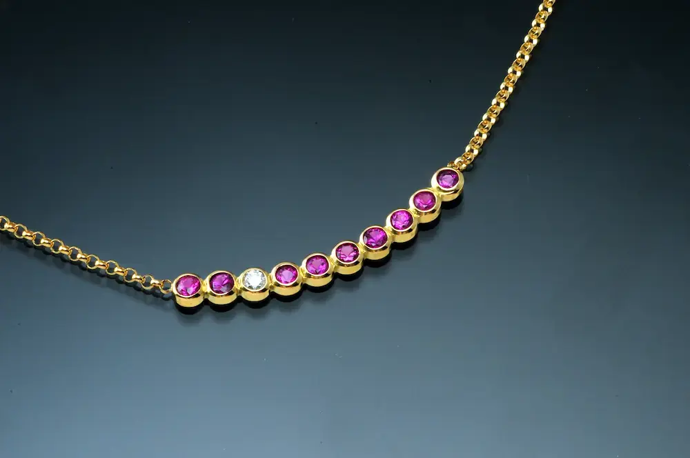 curved bar rubies and diamonds necklace